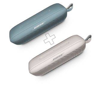 ⽯墨蓝和晨雾白 SoundLink 扬声器，中间放了一个加号标志，表示进行派对模式配对